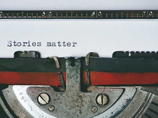 close up of the words Stories matter typed on an old typewriter